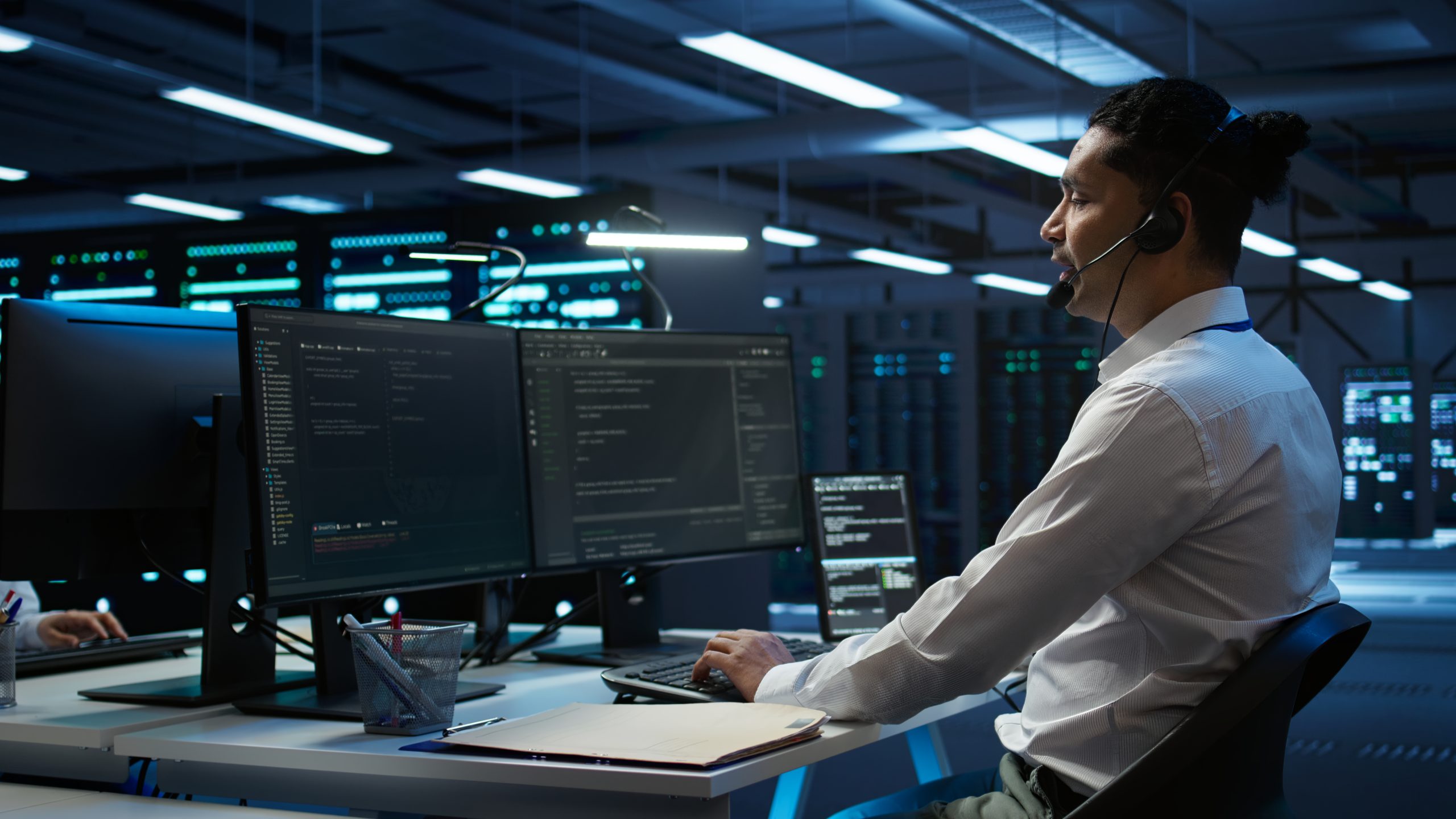 IT support specialist working inside data center