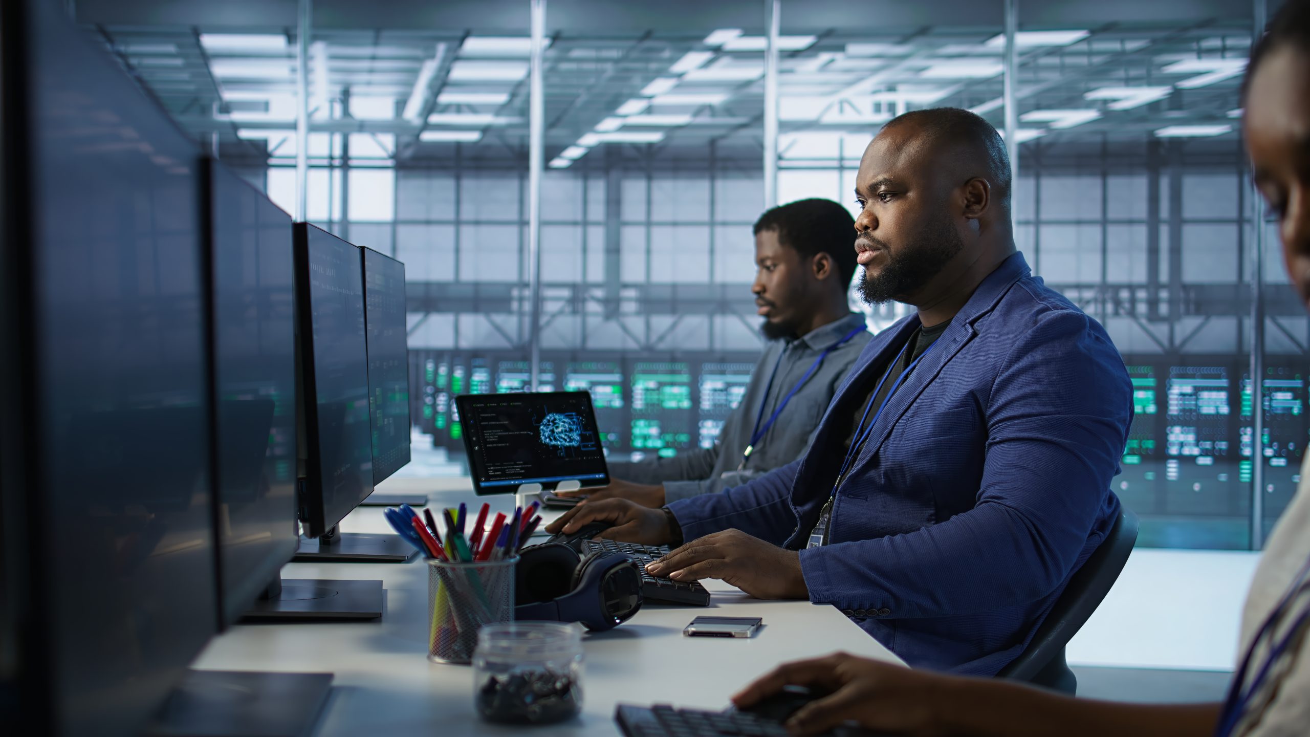 IT professionals working in stations inside data cente