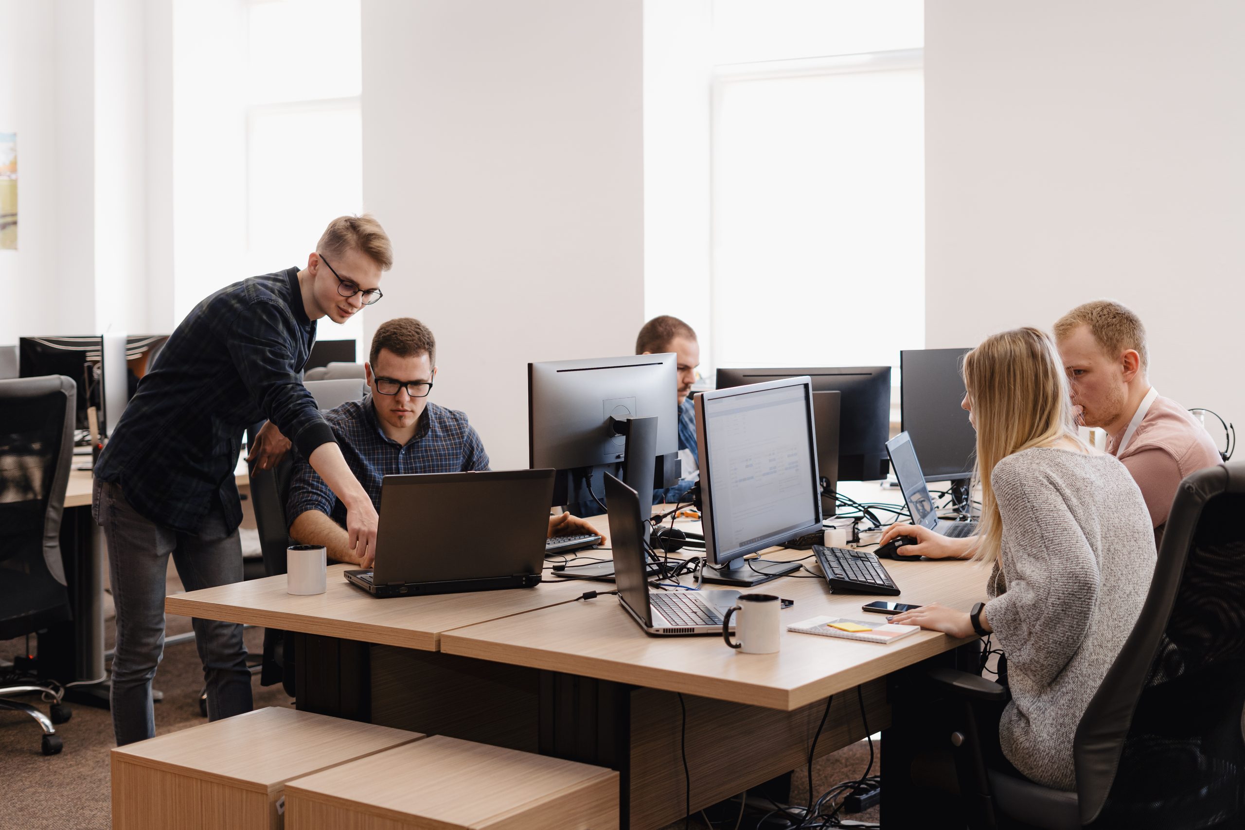People working in a bright office.